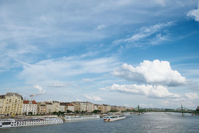 Panoramic view of sea and buildings against sky