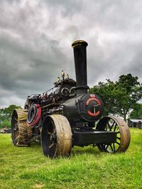 Tractor on field against sky