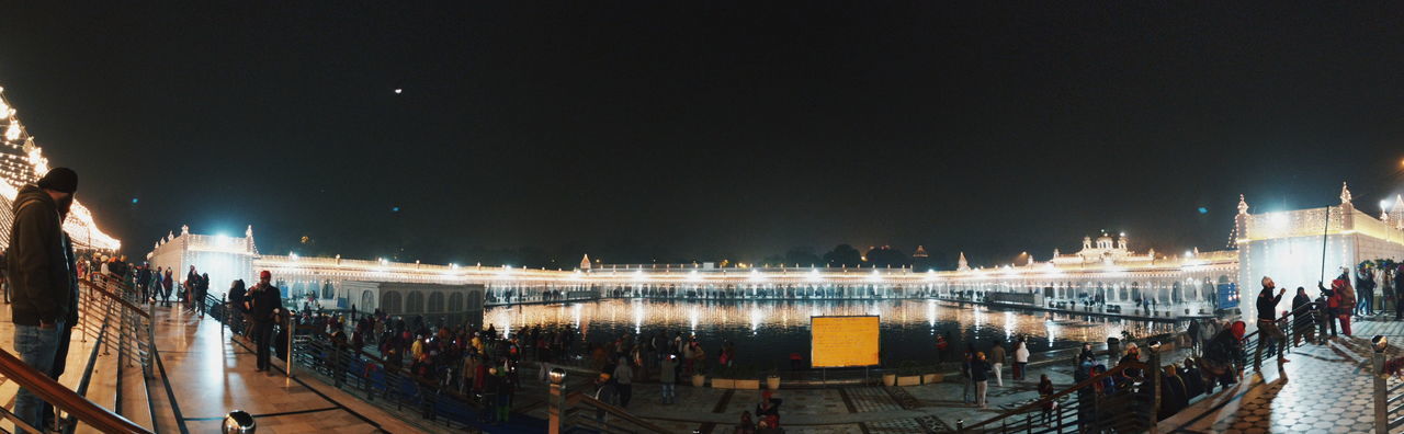 PANORAMIC VIEW OF CROWD AT NIGHT