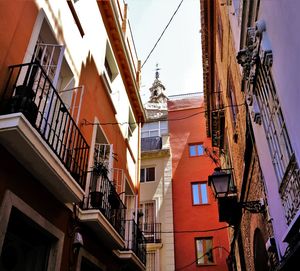 Low angle view of buildings in city against sky