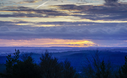 Scenic view of dramatic sky over field