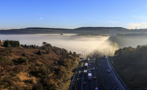 High angle view of road amidst plants against sky