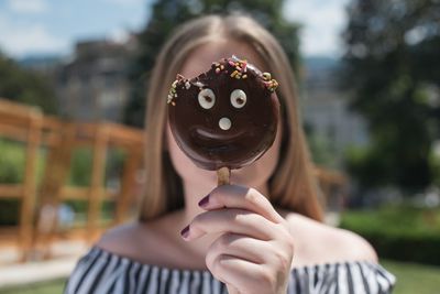 Close-up of hand holding ice cream