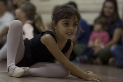 Cute girl looking away on floor at home