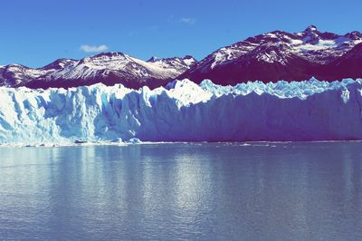Scenic view of lake against cloudy sky