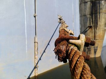Close-up of rope tied on rusty metal
