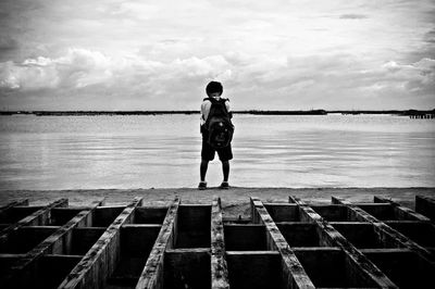 Man standing on pier