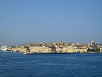 Scenic view of sea against clear blue sky