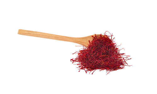 Close-up of red chili pepper against white background