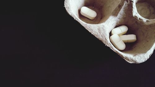 Close-up of cake against black background