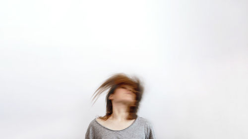 Portrait of woman against white background