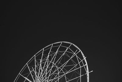 Low angle view of illuminated ferris wheel