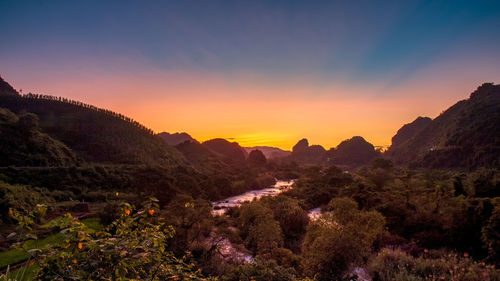 Scenic view of mountains against sky during sunset