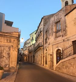 Narrow alley amidst buildings in ragusa, sicily 