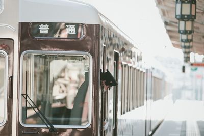 Reflection of train on glass window