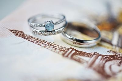 High angle close-up of wedding rings on table
