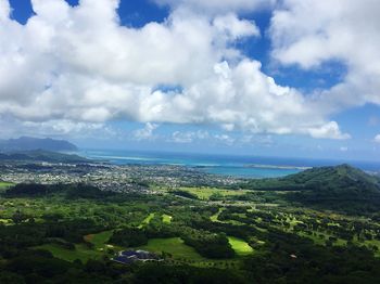 Scenic view of landscape against cloudy sky