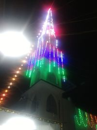 Low angle view of illuminated statue at night