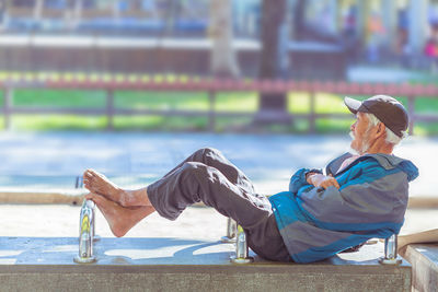 Rear view of man sitting on seat