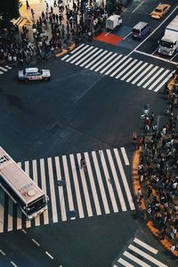 High angle view of cars crossing on road