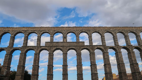 Roman aqueduct in segovia, spain. famous romanesque architecture