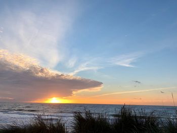 Scenic view of sea against sky during sunset