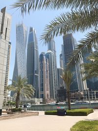 Modern buildings in city against sky