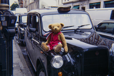 View of stuffed toy car in city