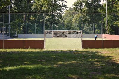 View of soccer field against trees