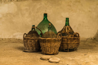 Close-up of bottles in basket