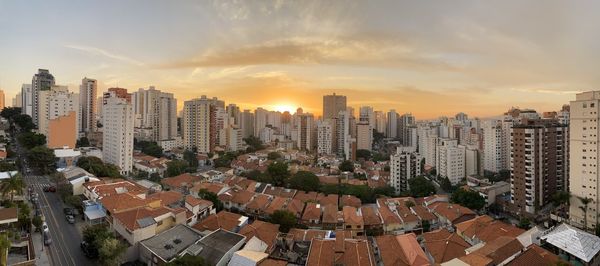 High angle view of buildings against sky during sunset