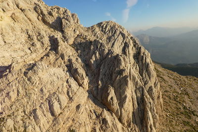 Panoramic view of rocky mountains against sky