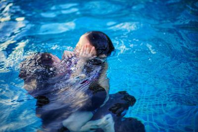 High angle view of man swimming in pool