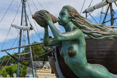 Low angle view of statue against sky