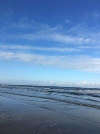 Scenic view of sea against blue sky