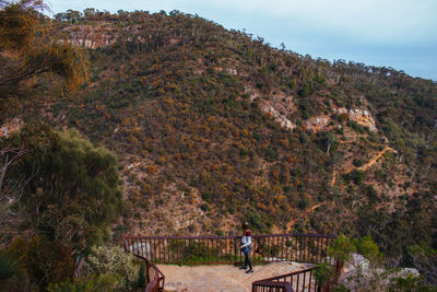 High angle view of young woman standing on observation point