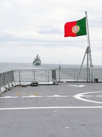 Portuguese flag on ship at sea