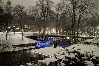 Bridge over river during winter