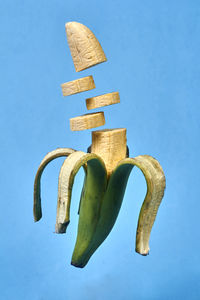 Close-up of bananas against blue background