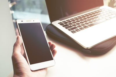 Close-up of mobile phone on table