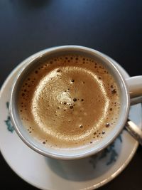 High angle view of coffee cup on table