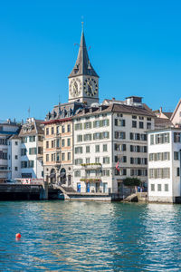 View of buildings against blue sky