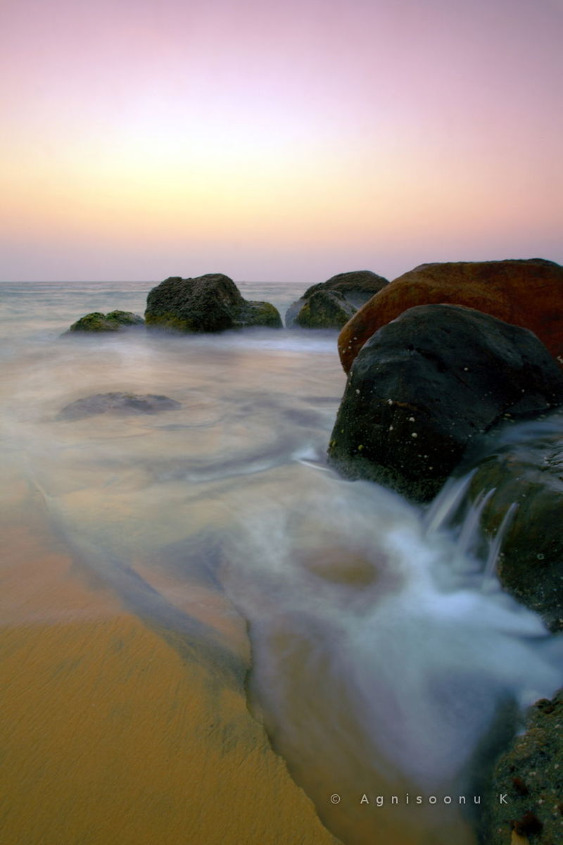 sea, water, scenics, horizon over water, beauty in nature, sunset, beach, surf, wave, tranquil scene, nature, motion, shore, sky, idyllic, tranquility, rock - object, clear sky, outdoors, splashing