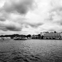 Buildings against cloudy sky