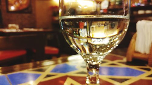 Close-up of wine in glass on table