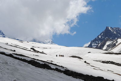 Scenic view of snow covered mountains against sky