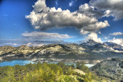 Scenic view of landscape against dramatic sky