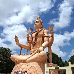 Low angle view of statue against sky