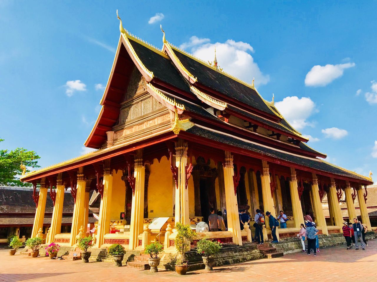 architecture, built structure, building exterior, sky, cloud - sky, place of worship, day, nature, building, belief, group of people, architectural column, men, religion, real people, travel, travel destinations, spirituality, women, outdoors