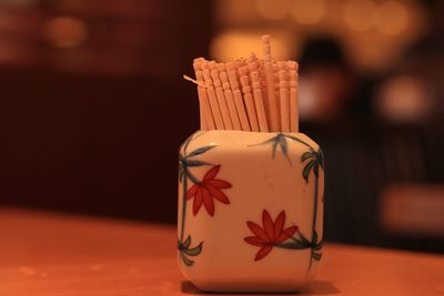 Close-up of toothpicks on table
